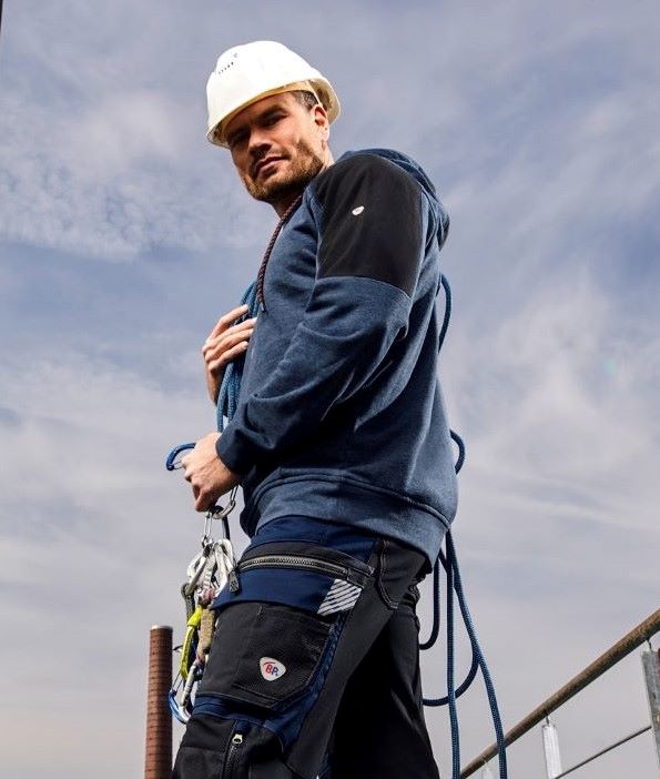 A craftsman wears PPE clothing.